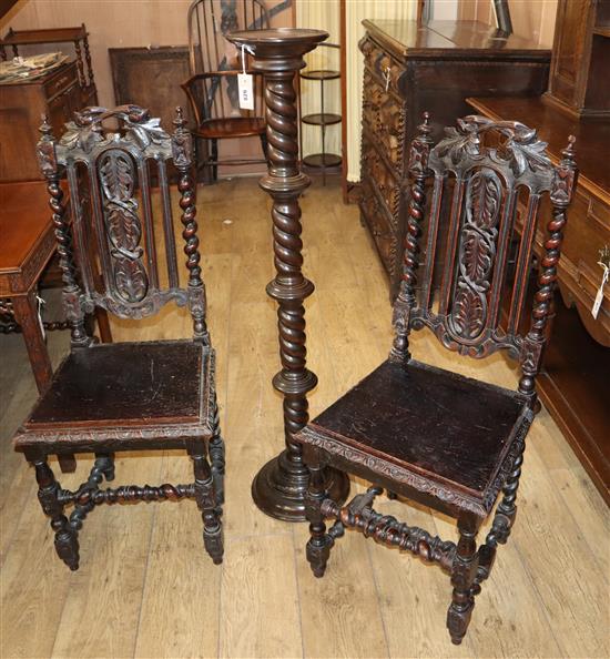 A pair late Victorian Flemish oak dining chairs and a torchere